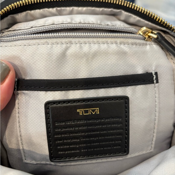 TUMI crossbody sling travel bag Great condition Black gold trim no odors/ tears - Picture 13 of 13
